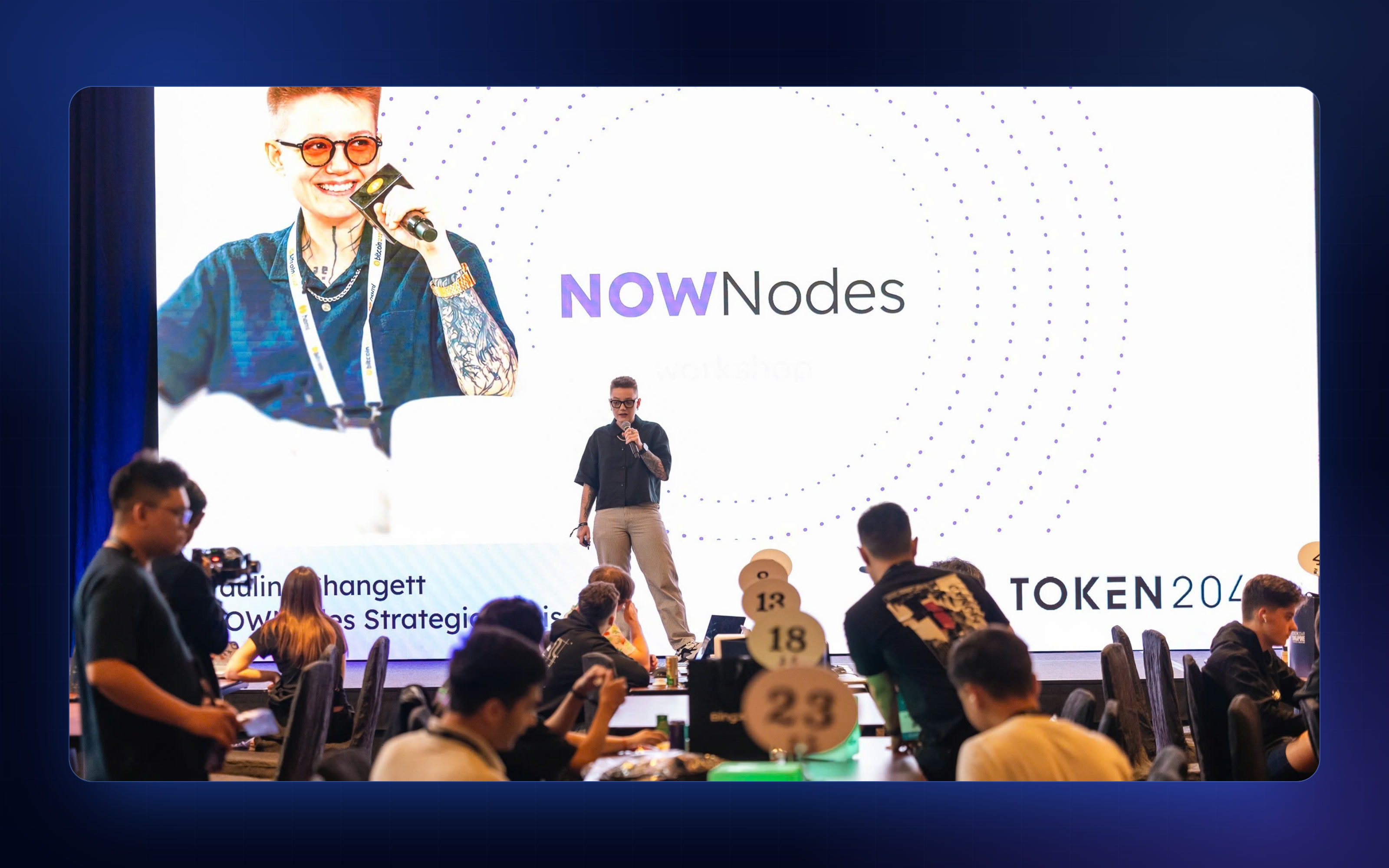 Teams working at their tables during a sponsor workshop at the TOKEN2049 Origins Hackathon