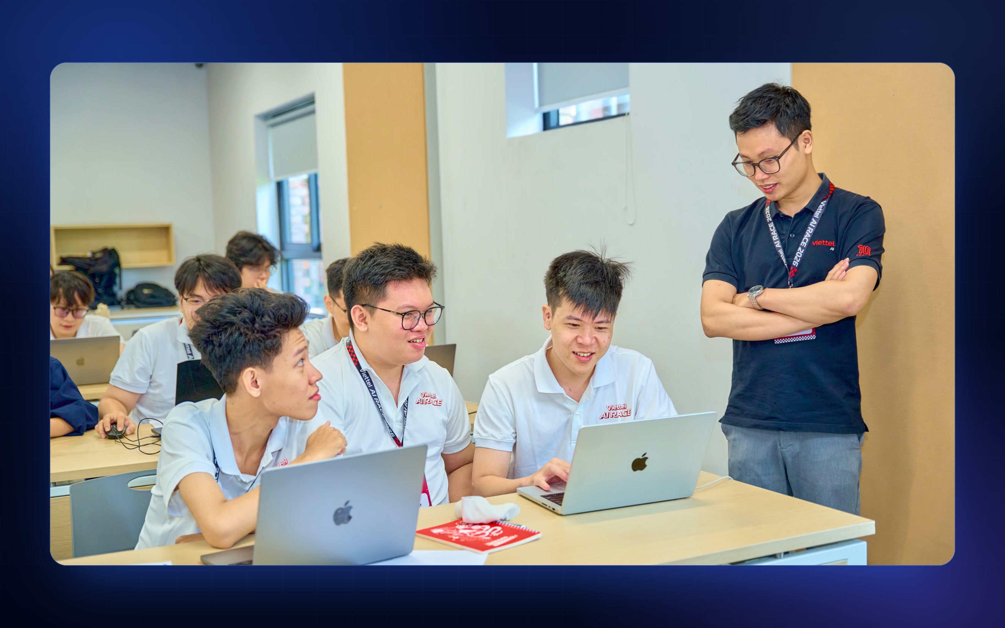 Finalists comparing results on their laptops at the Viettel AI Race 2026